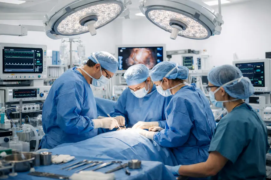 Anesthesia team preparing a patient in the operating room