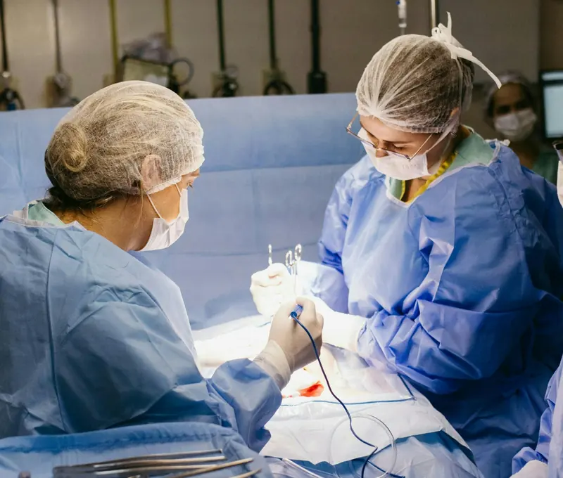 Young clinicians working together in an operating room